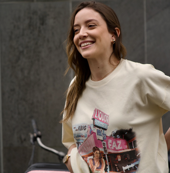 a woman smiling with her hands on her hips